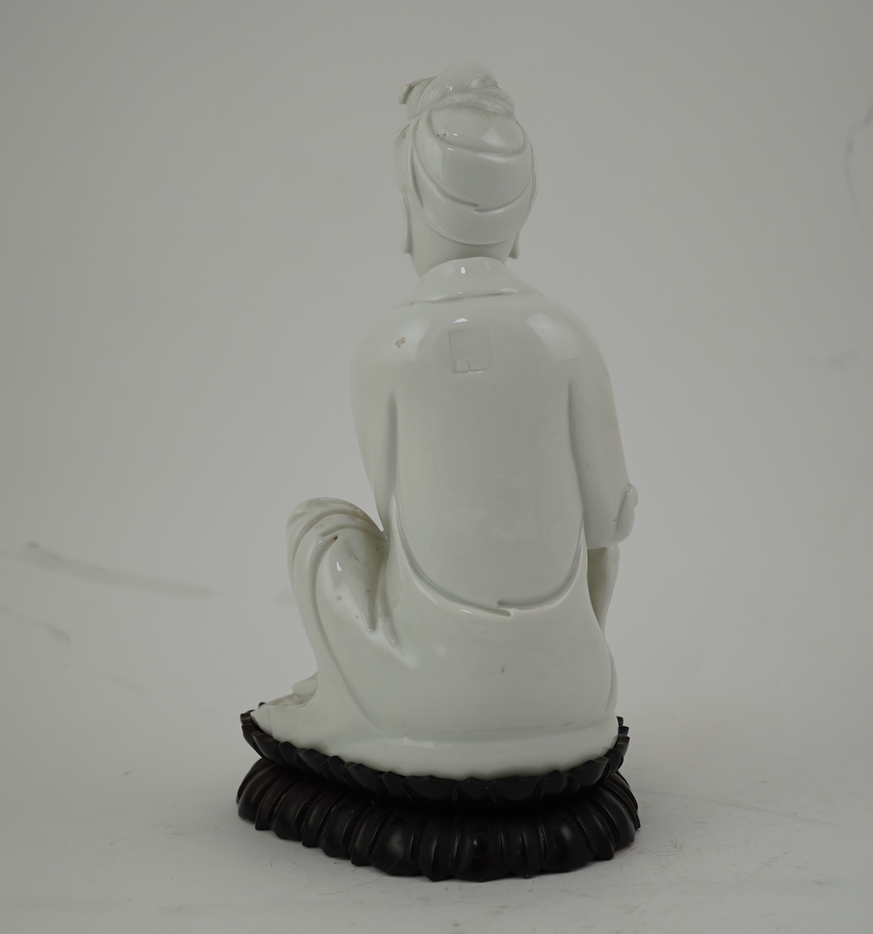 A Chinese blanc-de-chine seated figure of Guanyin, late 19th/early 20th century